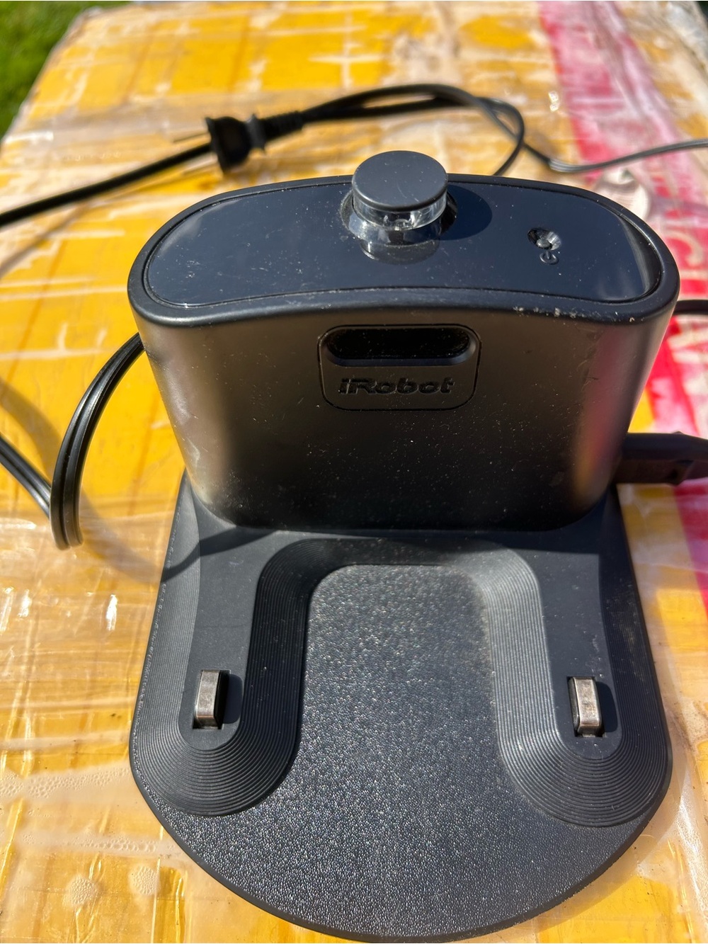 iRobot Charging Dock Station in Black with cable charging.
